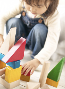 Girl Playing With Building Blocks