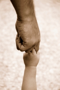 holding child's hand
