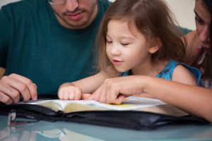 61616305 - young family studying the word of god