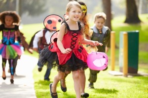 42307388 - children in fancy costume dress going trick or treating