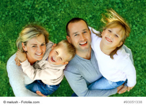 portrait of a happy family smiling a top view